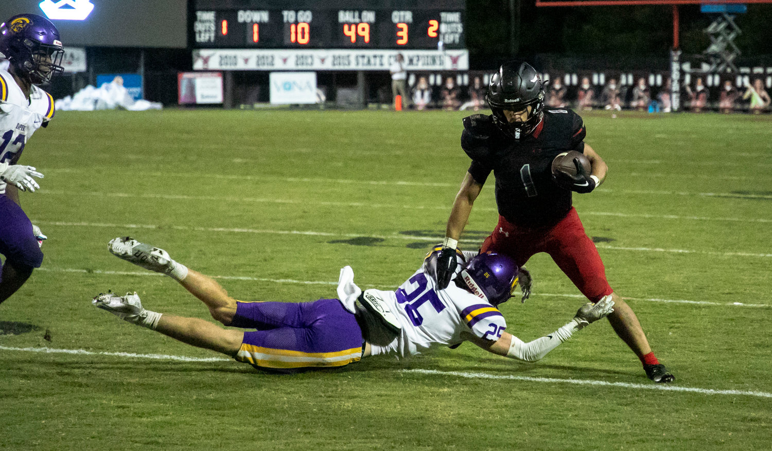 Spanish Fort senior Jacob Godfrey sheds a tackle during the Toros non-region rivalry game against the Daphne Trojans Friday night at Spanish Fort Stadium. Godfrey’s third-quarter touchdown helped the Toros win 18-15.