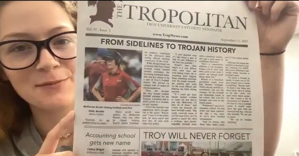 Troy freshman and Baldwin County alumna McKenzie Bryant holds up the September 15 edition of The Tropolitan, Troy’s student newspaper, where she was featured above the fold.