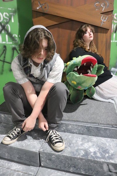 Audrey II terrorizes the residents of Skid Row, Josiah Thomas and Caymen Elizabeth Russell, in this re-telling of "Little Shop of Horrors" by Exit Stage Left in Foley. The show opens tonight and runs all weekend.