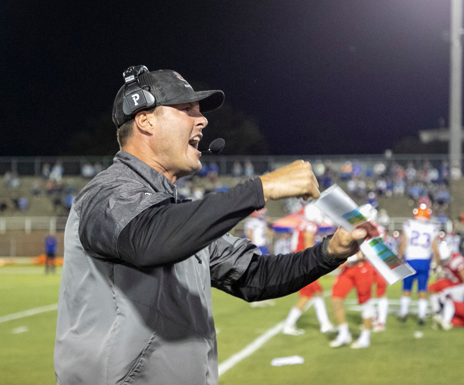 St. Michael head coach Philip Rivers celebrates a defensive turnover on downs in the first quarter of the Cardinals’ region tilt with the Orange Beach Makos Thursday at Fairhope Municipal Stadium. St. Michael won 49-41.