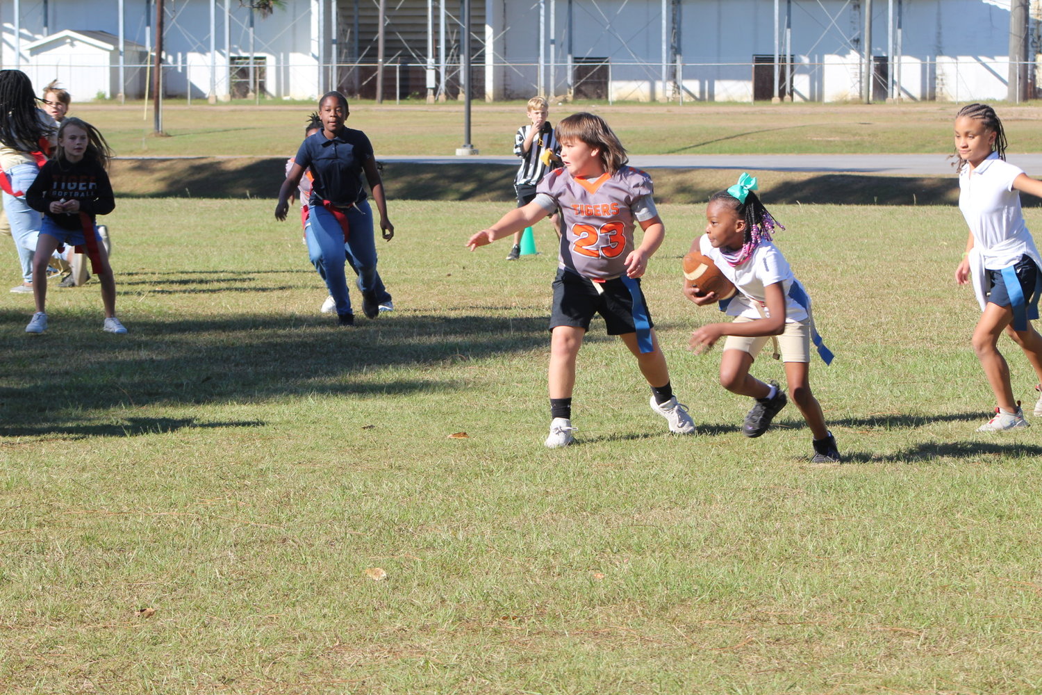 Eyes on the prize. A ball carrier looks for running room during the first round of the flag football playoffs Friday, Sept. 30, at Bay Minette Elementary School. The nine-week regular season has led to the postseason that will soon crown a champion.