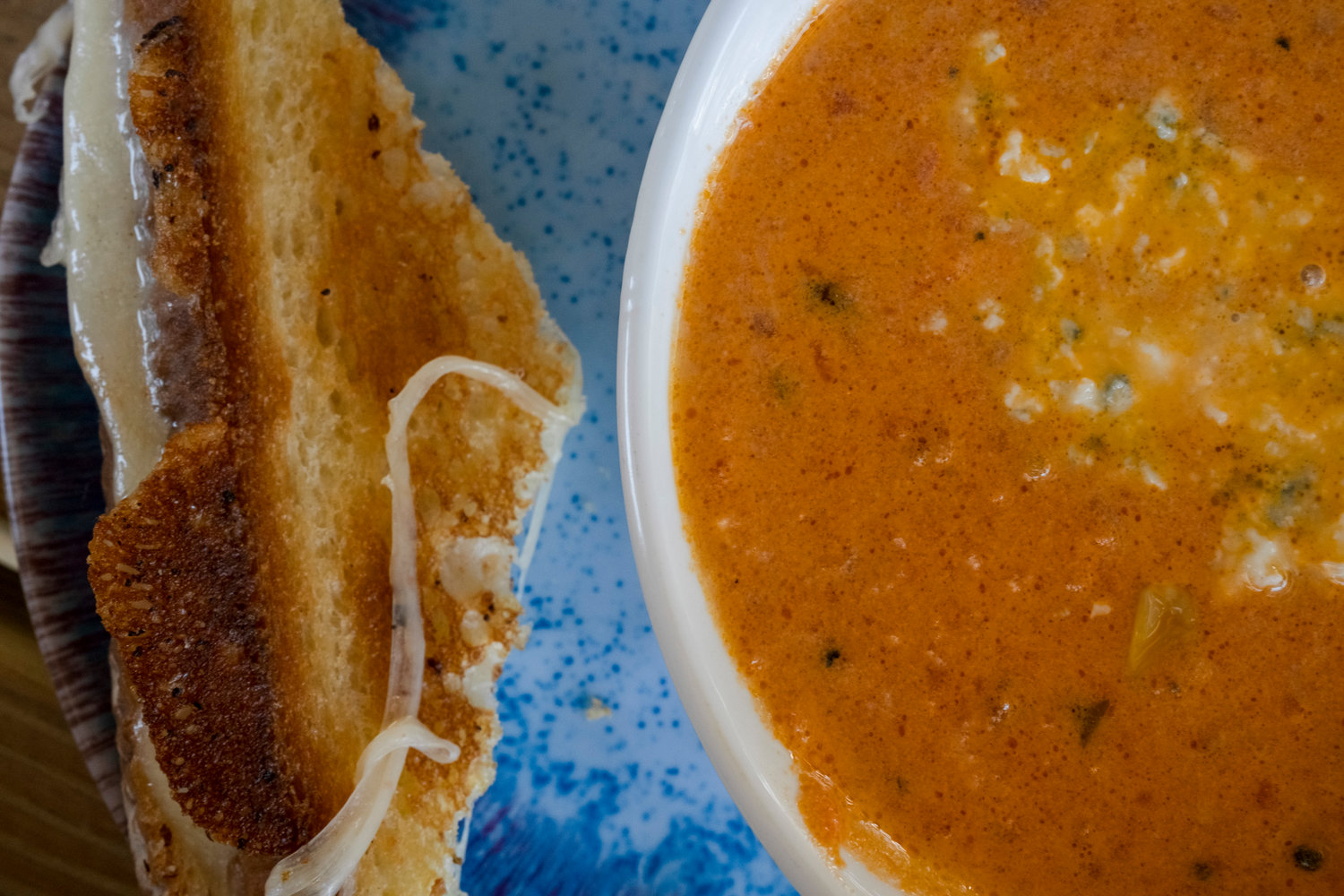 The tour stop at Bay Breeze Cafe includes the tomato and corn bisque with blue cheese crumbles and the grown-up grilled cheese.