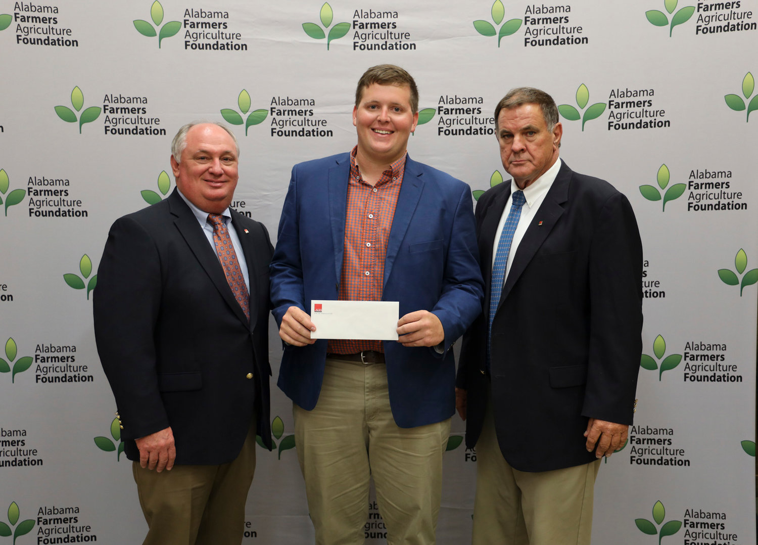 Baldwin County native and Auburn University student Garrett Springs received a $1,750 scholarship from the Alabama Farmers Federation Agriculture Foundation and the Baldwin County Farmers Federation. He was recognized during the Alabama Farmers Federation scholarship reception Sept. 26 at Lazenby Farms in Auburn. Springs is a senior studying agricultural science. From left are Federation President Jimmy Parnell, Springs and Federation Southwest Area Vice President Jake Harper.