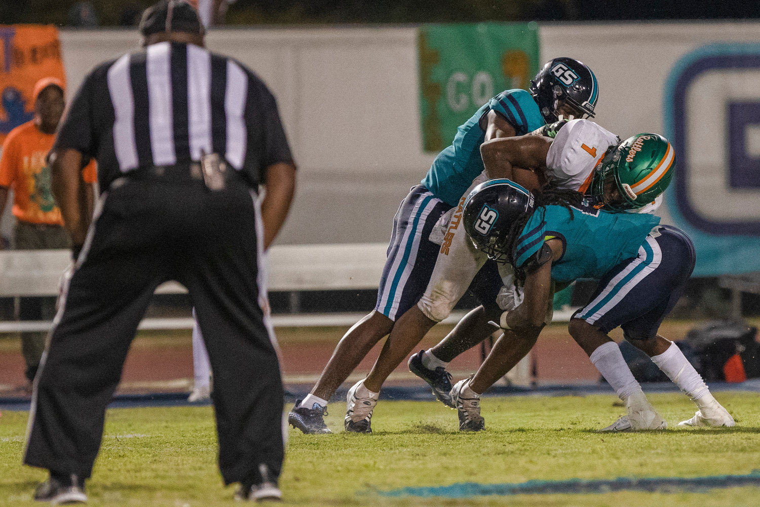 The Gulf Shores defense rallies for a stop during the Dolphins’ homecoming contest against the LeFlore Rattlers at home Sept. 16. Gulf Shores returns home Thursday to host the Elberta Warriors for another region battle.