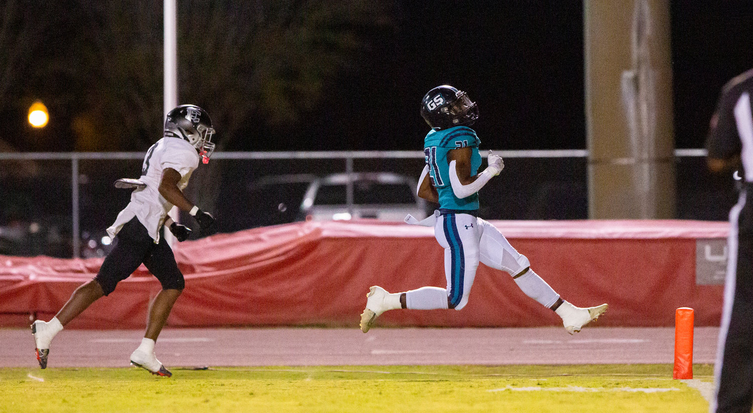 Gulf Shores senior running back JR Gardner skips into the end zone for the game-opening score against the Elberta Warriors in region action Thursday night at the Sportsplex. Gardner added another touchdown in the second quarter in the Dolphins’ 49-3 win.