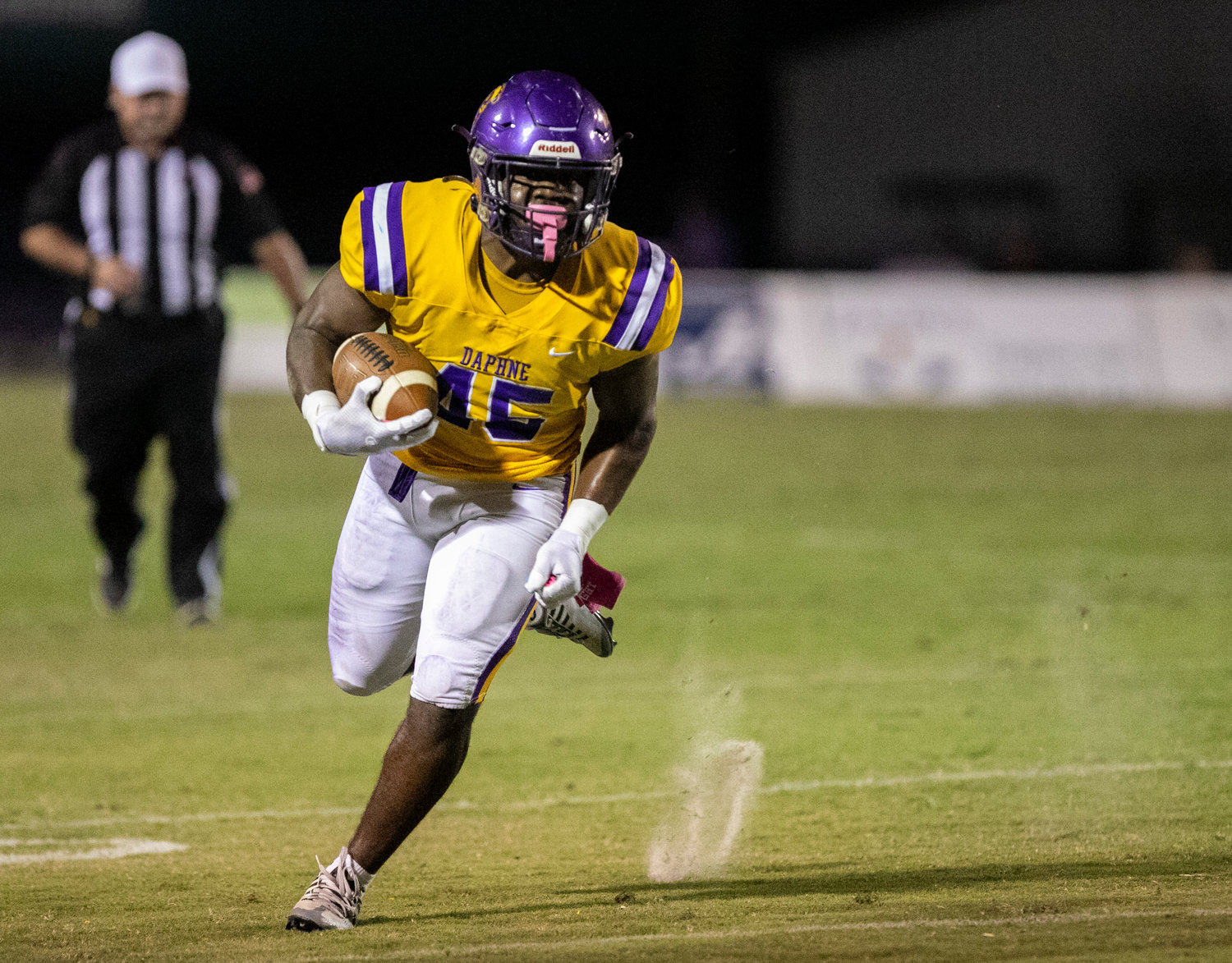 Daphne junior Nick Clark looks for running room near the sideline in the first half of the Trojans’ home region tilt with the Fairhope Pirates at Jubilee Stadium Friday night. Clark scored on a 7-yard rush in the third quarter.