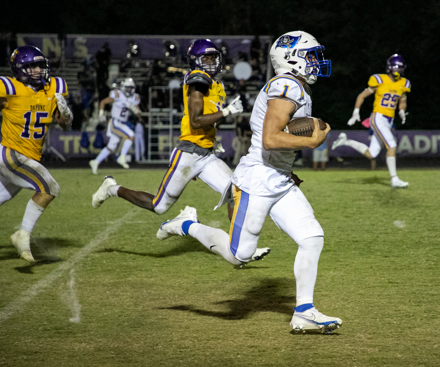 Pirate senior Caden Creel hits the open field on his long touchdown run that helped Fairhope earn a 26-7 road win over the Daphne Trojans at Jubilee Stadium Friday night.