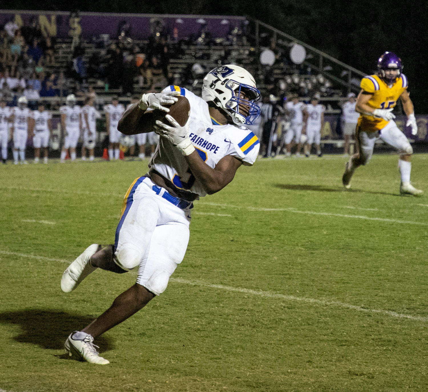 Fairhope junior Preston Godfrey secures a catch and looks for running room during the Class 7A Region 1 game between the Pirates and Daphne Trojans Friday night at Jubilee Stadium in Daphne. Godfrey ran for touchdowns and caught another in Fairhope’s 26-7 win.