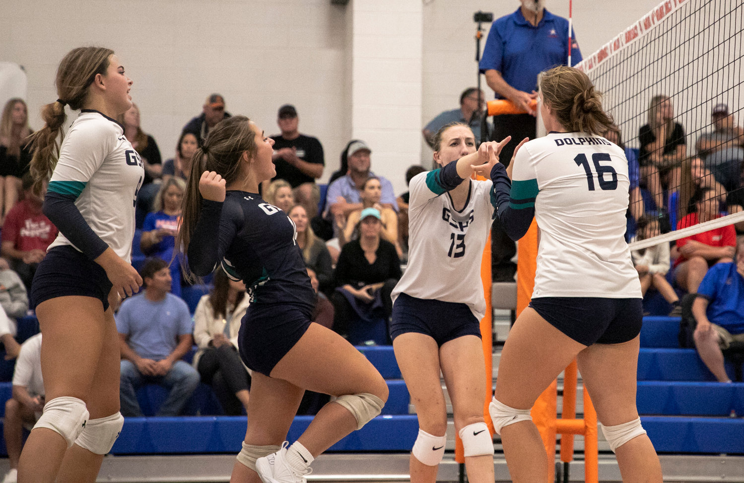 The Gulf Shores Dolphins celebrate a point during tri-match action against Curry at Orange Beach High School Aug. 25. Gulf Shores earned a pair of regional wins to punch its first ticket to the state tournament since 2011.
