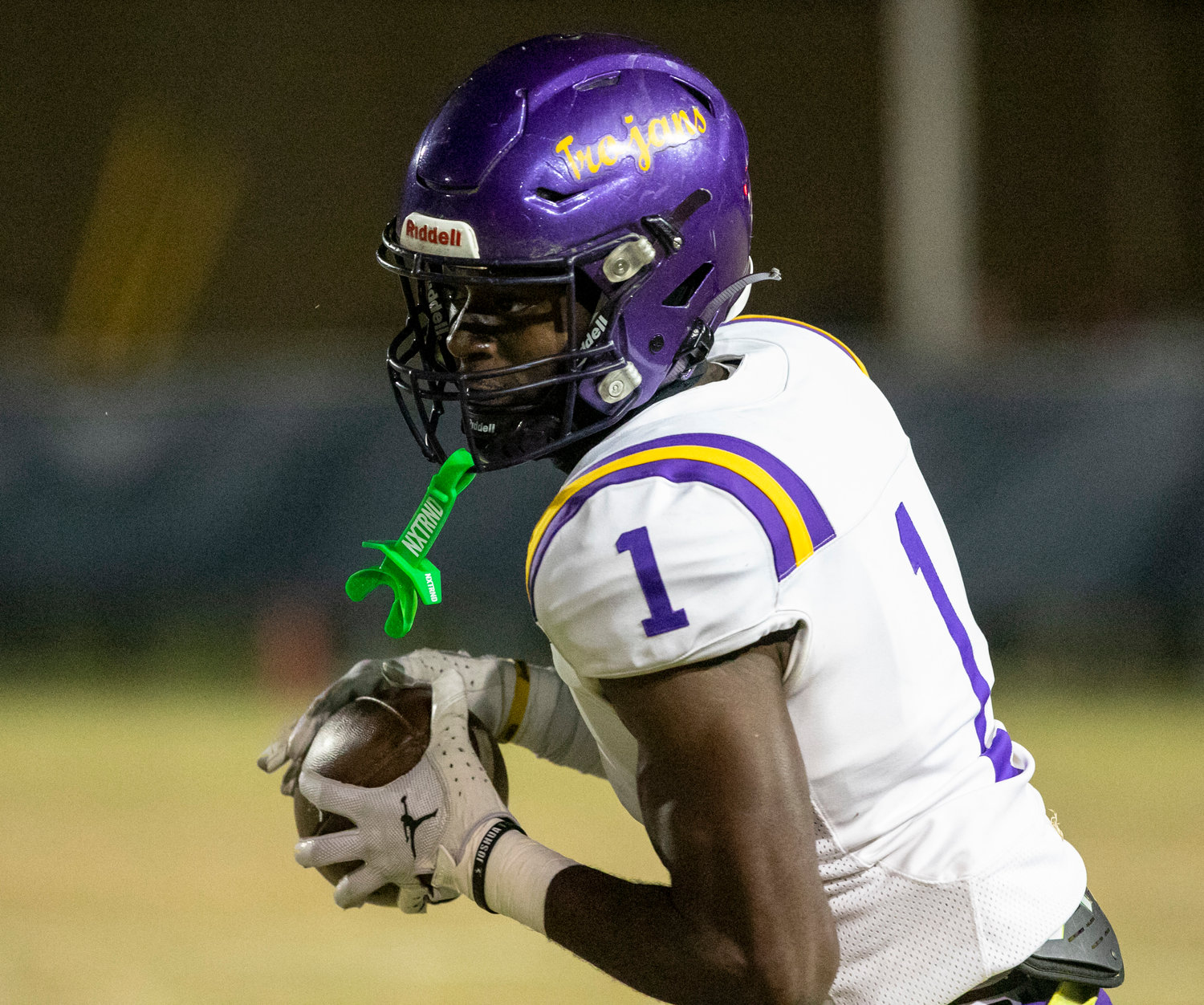 Daphne receiver Stacey Boykins reels in a catch and looks upfield in the first half of the Trojans’ Class 7A Region 1 title game against the Foley Lions at Ivan Jones Stadium in Foley.
