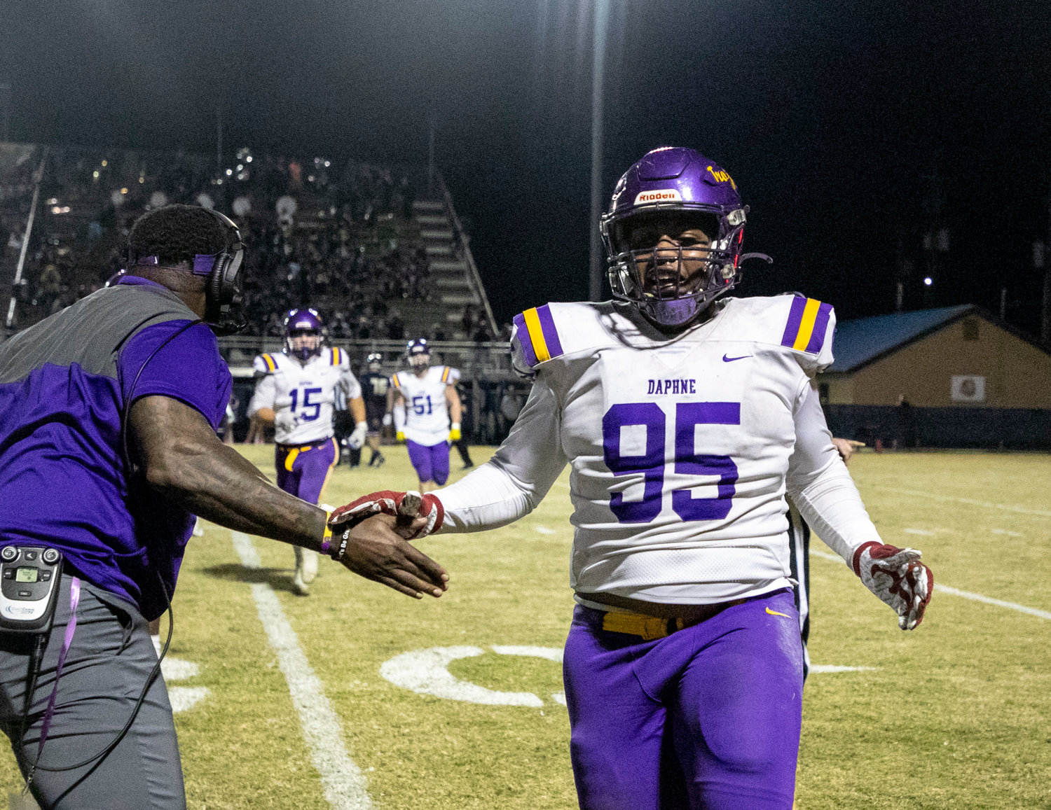 Trojan defensive end Johnnie Perdue celebrates Daphne’s recovery of a fumble in the third quarter of the Class 7A Region 1 title game at Ivan Jones Stadium in Foley.