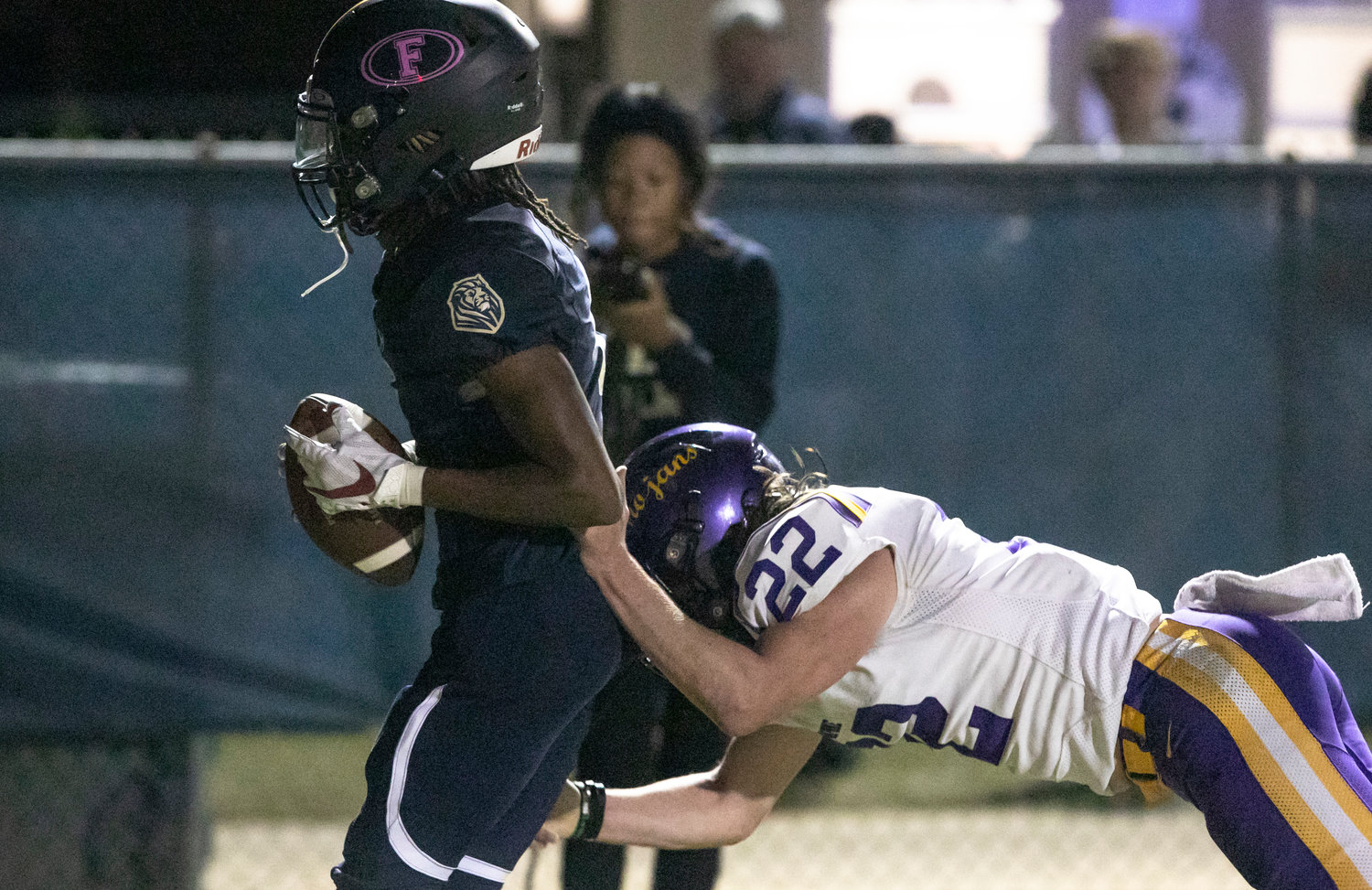 Lion receiver Makai Mitchell secures his first-half touchdown pass from Reese Tynes in the corner of the end zone to help Foley down Daphne 34-7 Friday night to claim its first region title since 2007.