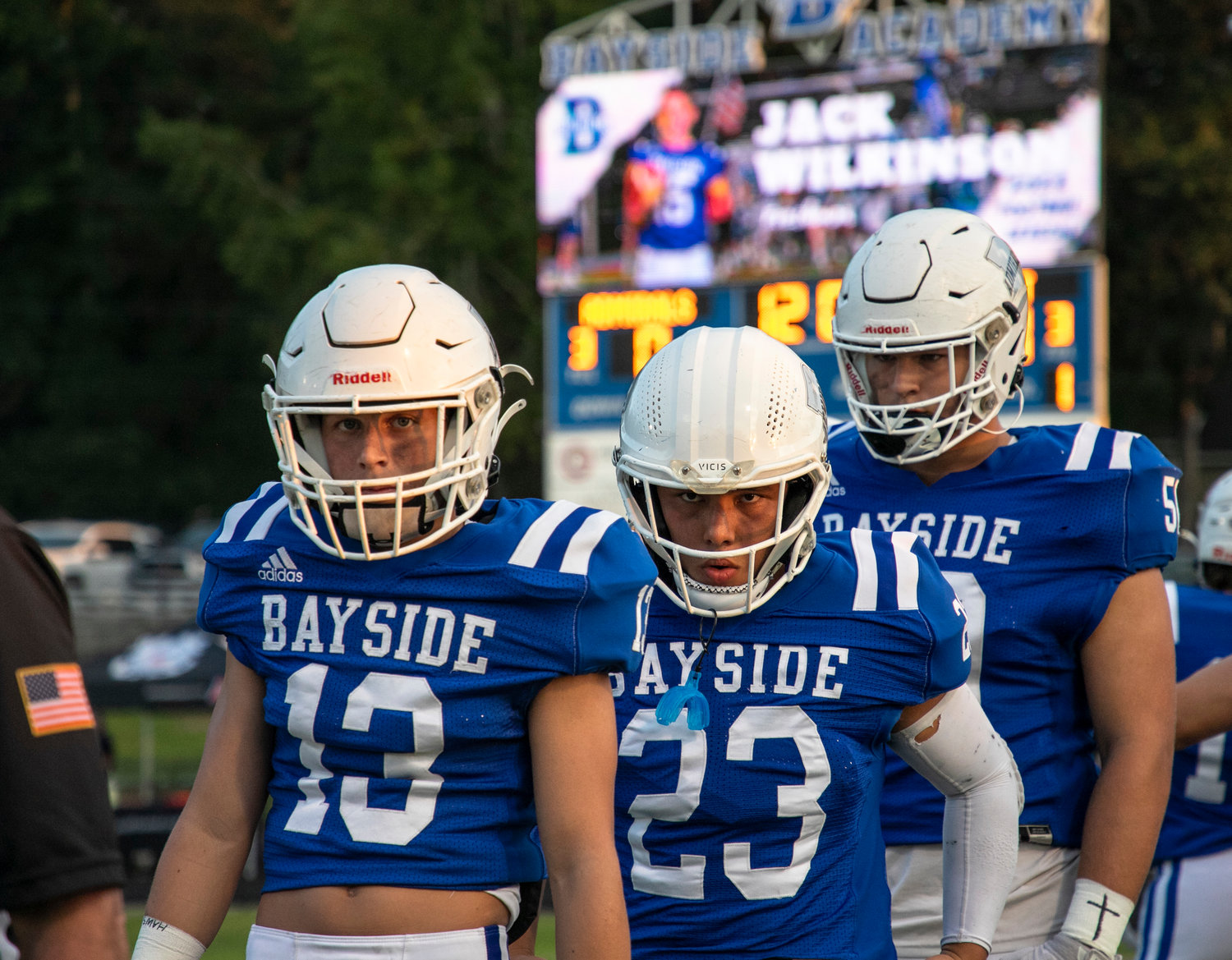 Wills Norton (13), Brennan Yamane (23), Graham Uter (50) and the Admiral captains walk out for the coin toss ahead of Bayside Academy’s region-opening game against St. Michael Sept. 2 at Freedom Field. Norton returned an interception and punt each over 50 yards and Yamane ripped off a 54-yard touchdown run in the Admirals’ 41-7 win over Satsuma last Friday.