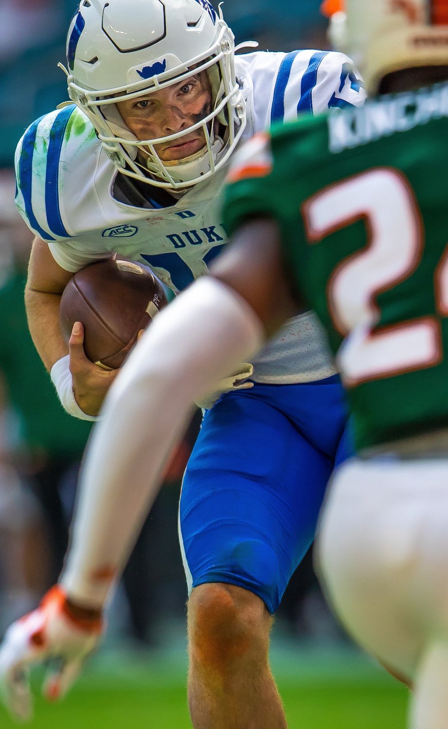 Former Fairhope Pirate quarterback Riley Leonard bears down on a Miami defender on one of his rushing attempts during the Duke Blue Devils’ away conference game against the Hurricanes at Hard Rock Stadium Oct. 22. Leonard said it was in Fairhope that he learned how to really run behind his pads.