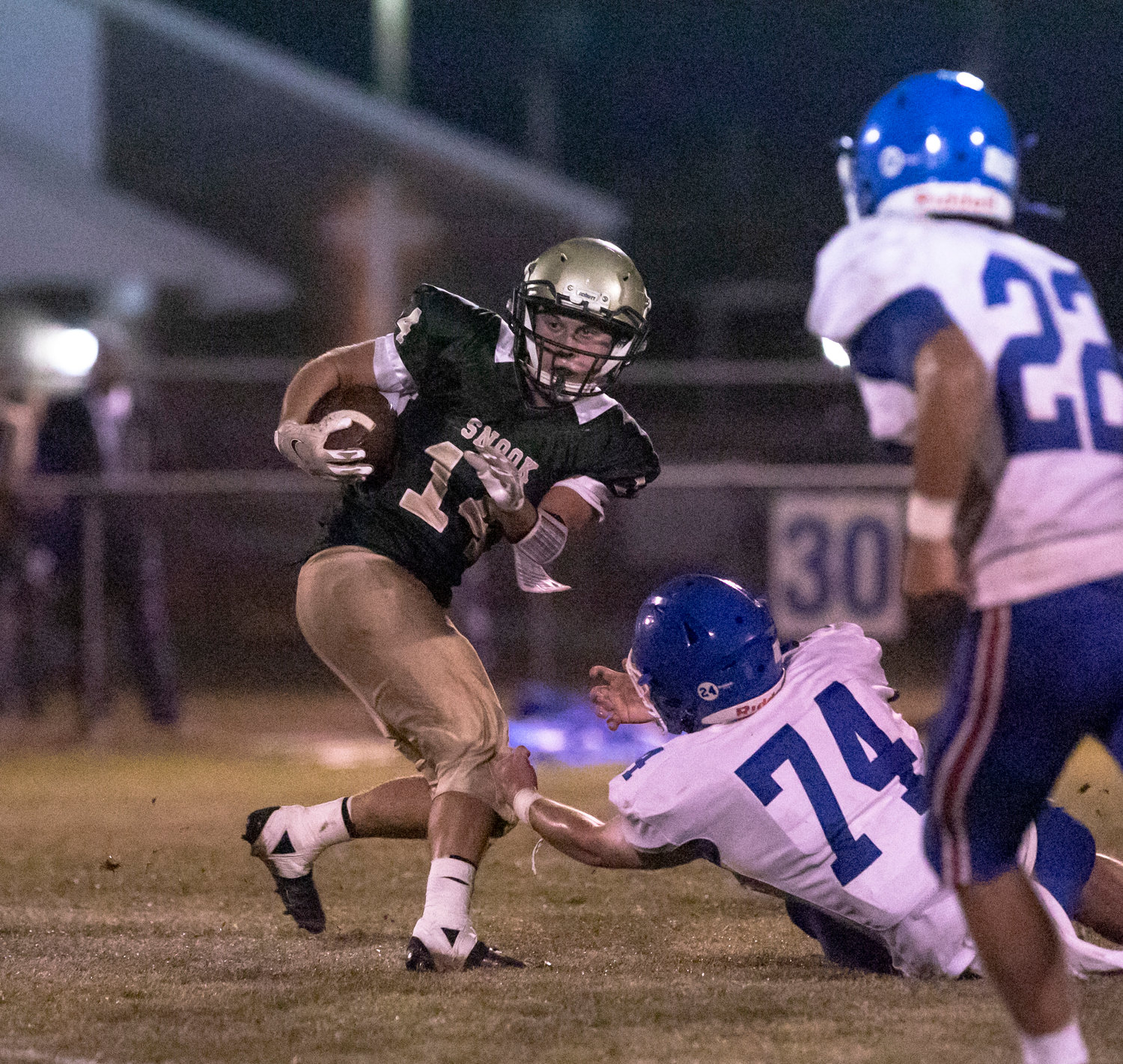 Eagle junior Corbin Hall spins off a defender and looks for more running room after a catch in the first half of Snook Christian Academy’s last home game of the season against Crenshaw Christian Friday night.