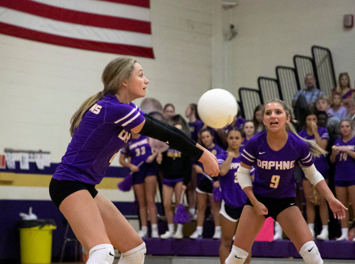 Daphne freshman Ella Lomax receives a serve during the Trojans’ area match against the McGill-Toolen Yellow Jackets at home Sept. 20. Lomax was one of three all-state representatives from Daphne on AHSVCA teams.
