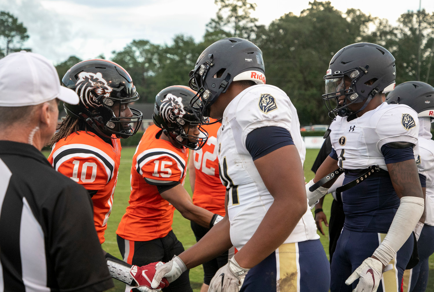 AJ Prim (31) and the Foley captains meet the Baldwin County Tigers’ captains ahead of the non-region game at Lyle Underwood Stadium in Bay Minette Aug. 26. Prim was named one of two Lion representatives recently selected to the AHSAA All-Star roster.