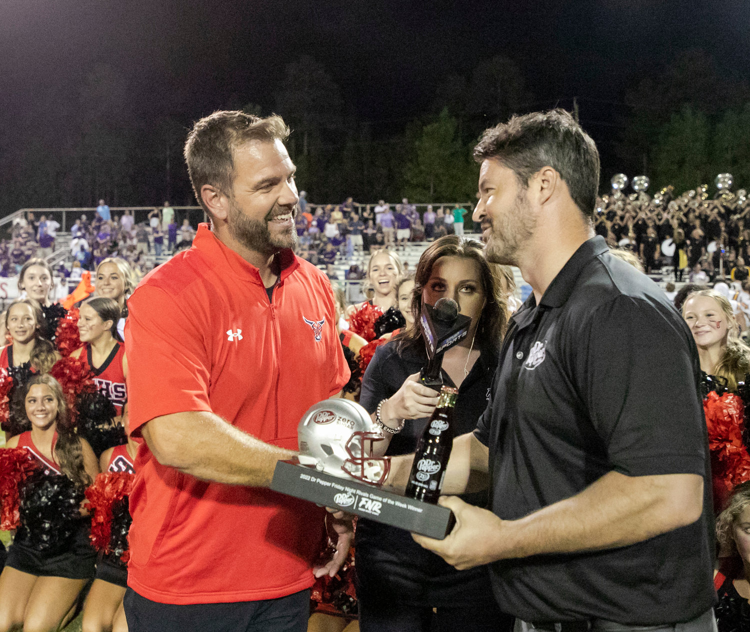 Spanish Fort head coach Chase Smith receives the Dr. Pepper trophy the Toros won for taking down rival Daphne Sept. 23 at home. Smith was named to the AHSAA All-Star coaching staff for the 64th annual game scheduled for Dec. 16 in Mobile.