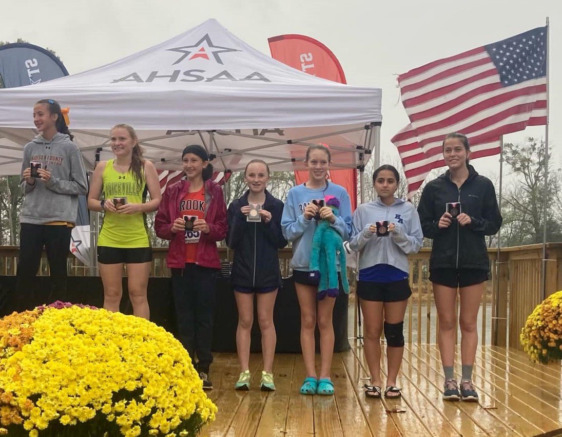 Orange Beach seventh-grader Brooke Barnett (center) finished ninth in AHSAA’s Class 4A cross country state championship to become the Makos’ first all-state representative Saturday, Nov. 5, in Oakville. Her 5K time registered as second-best in program history.