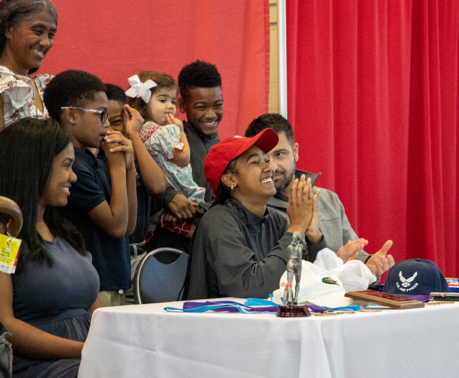 Tia Acker breathes a sigh of relief after she announced her decision to choose the South Alabama Jaguars over the UAB Blazers and Air Force Falcons during Wednesday’s signing ceremony at St. Michael Catholic High School.