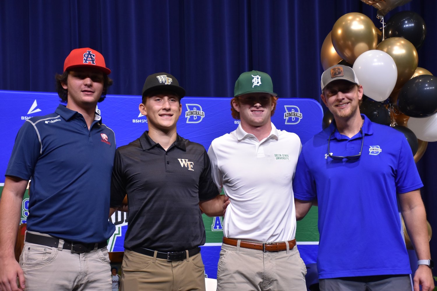 Bayside Academy seniors Jake DeValk (South Alabama), Josh Gunther (Wake Forest) and Jack Woods (Delta State) were joined by Admiral head baseball coach Matt Limbaugh in celebrating National Signing Day Wednesday, Nov. 9, at the high school.