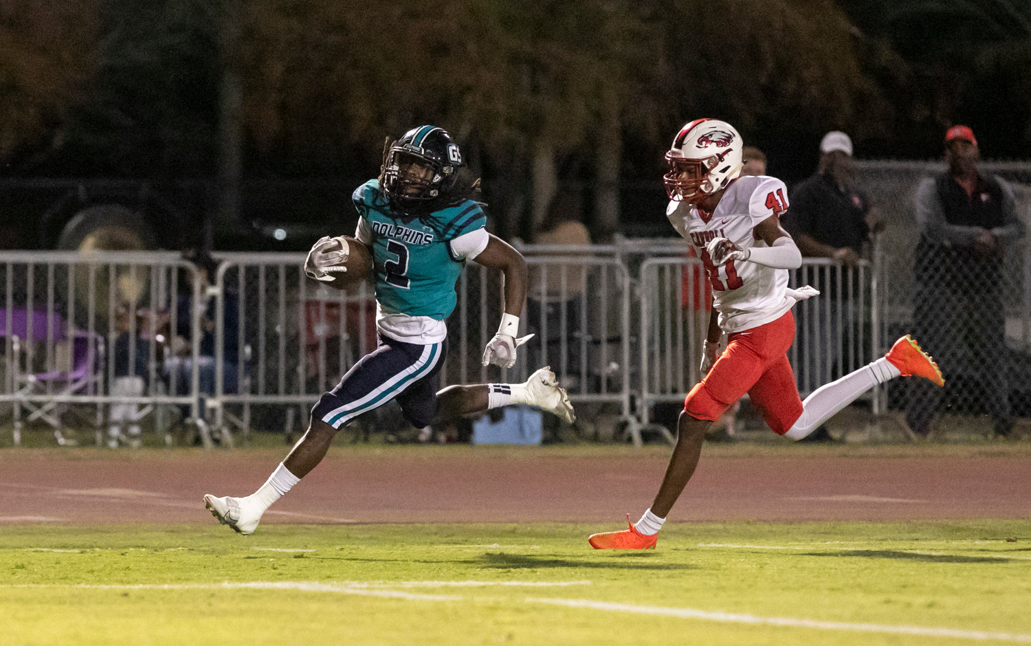 Dolphin running back Ronnie Royal sprints into the end zone to open the scoring in Gulf Shores’ first-round playoff game in the AHSAA state playoffs Nov. 4 at the Sportsplex. Royal recorded another three-touchdown game to help advance the Dolphins to the state quarterfinals next week.