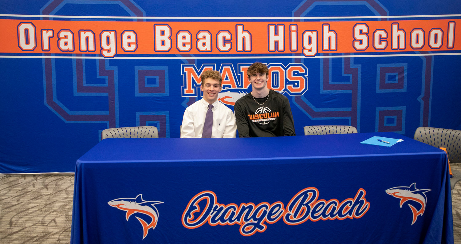 Orange Beach seniors Shayd Arboneaux and Joey Robertson pose for a picture after the signing ceremony hosted in the Media Center at the high school Monday, Nov. 14. Arboneaux signed with the Montevallo wrestling team and Robertson cemented his commitment to the Tusculum basketball squad to be the first Makos from their respective sport to sign with a college team.