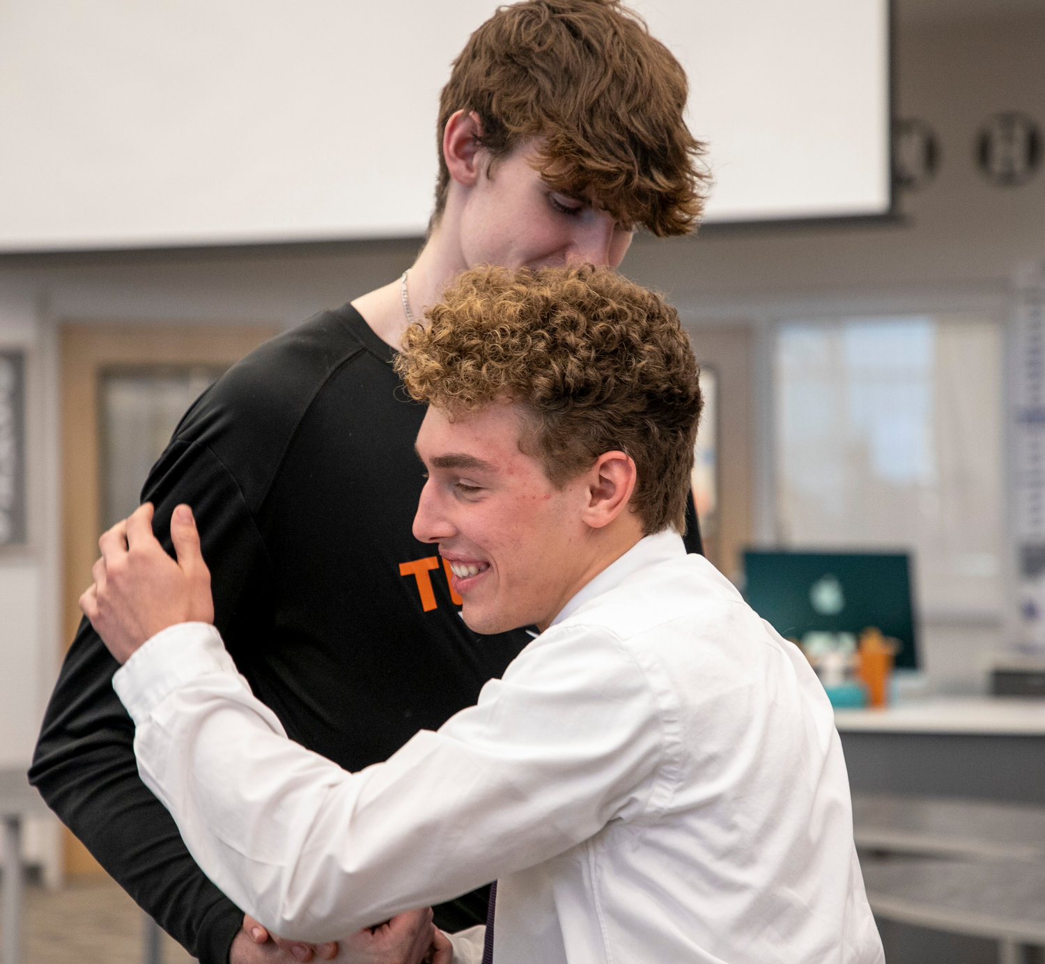 Joey Robertson and Shayd Arboneaux share an embrace after the Nov. 14 signing ceremony at Orange Beach High School. Robertson and Arboneaux became the first Makos to sign with college basketball and wrestling teams, respectively.