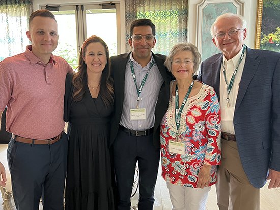 Beth Curles and her family pose with Pankit Vachhani, MD, (Center) during the 2022 UAB Oncology Review, where Beth shared her remarkable story.