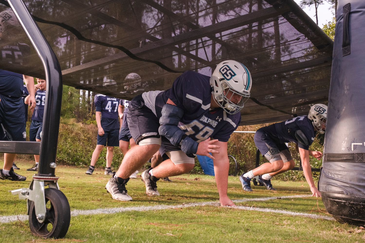 Dolphin senior Jackson Russ lines up for a practice drill Tuesday afternoon at Gulf Shores High School. The Dolphins put in the work as part of state quarterfinal preparations ahead of Friday’s contest against Faith Academy where Gulf Shores is hosting its second playoff game in program history.