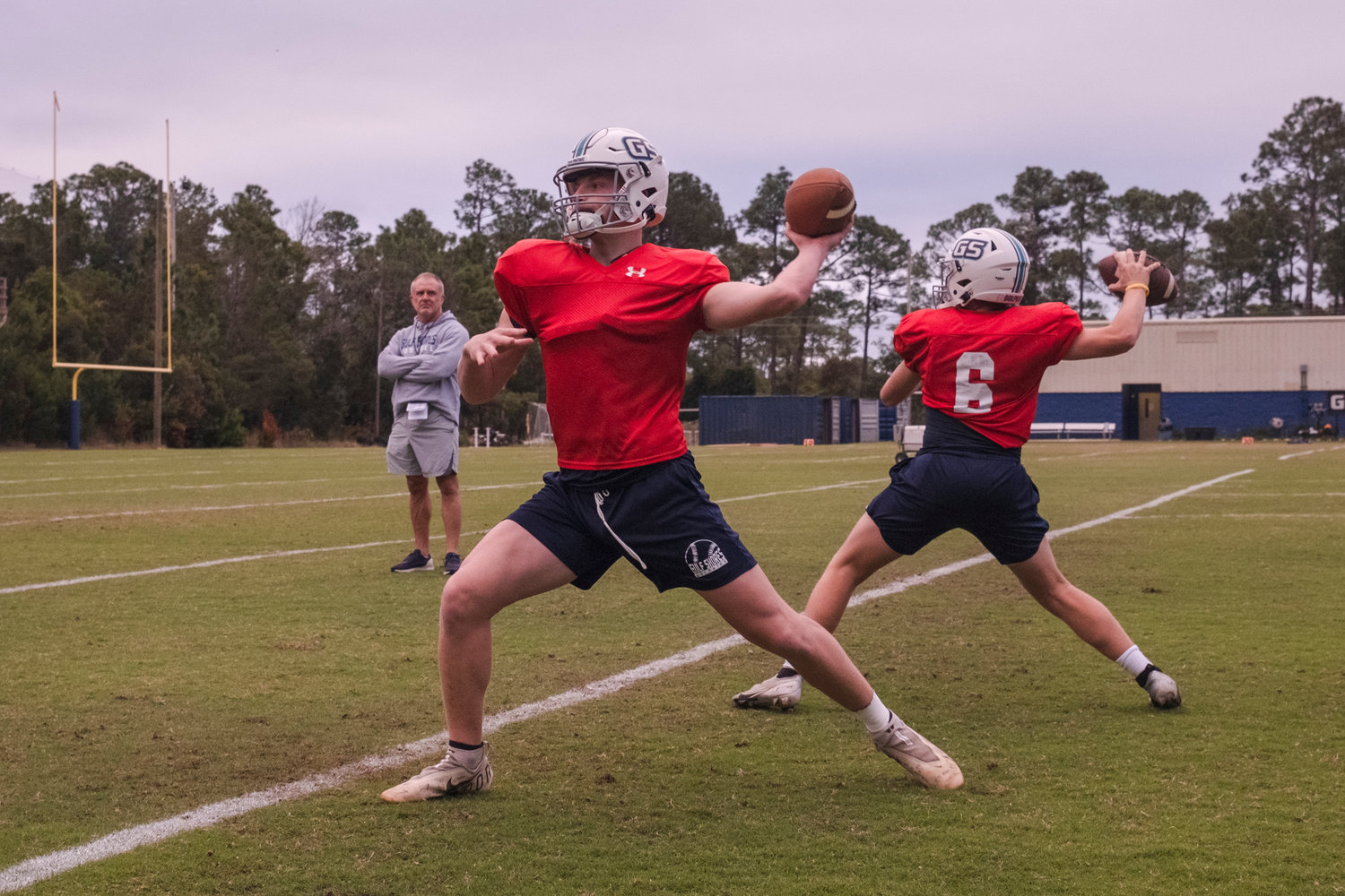 Gulf Shores senior quarterback Brendon Byrd (foreground) loads a throw during Tuesday afternoon’s practice at the high school. The Dolphins are in the third round of the AHSAA state playoffs for the first time ever and are set to host their second playoff game in three weeks Friday night against the Faith Academy Rams.