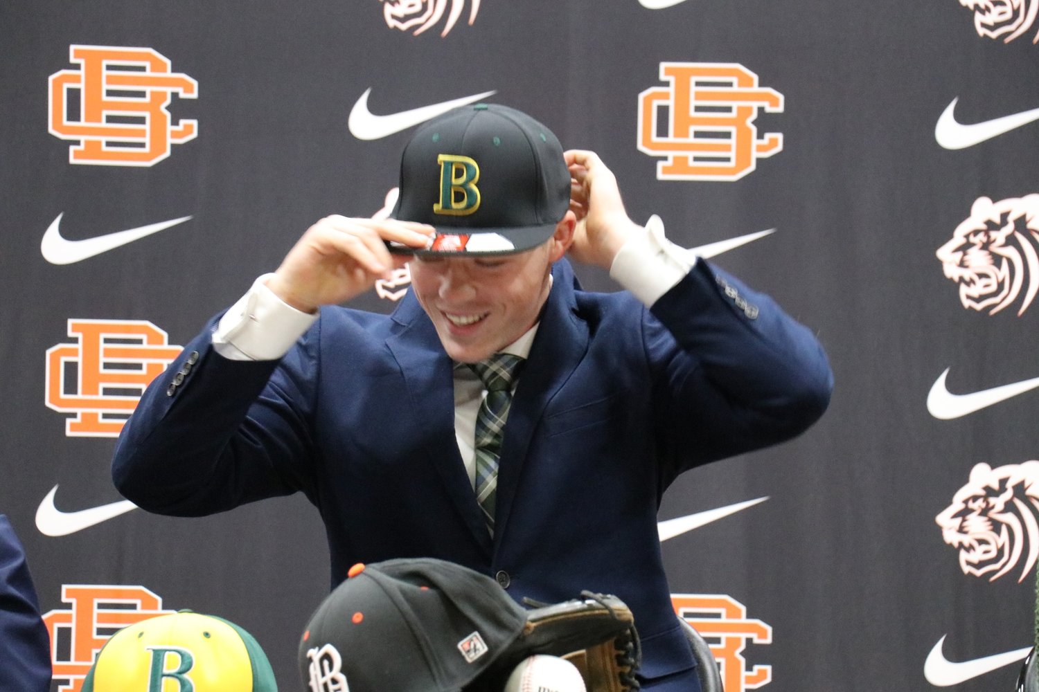 Baldwin County senior Trevor Murphy dons his new Bishop State baseball cap after he signed his National Letter of Intent to join the Wildcats after his final season with the Tigers. The high school hosted a signing ceremony Thursday, Nov. 17.