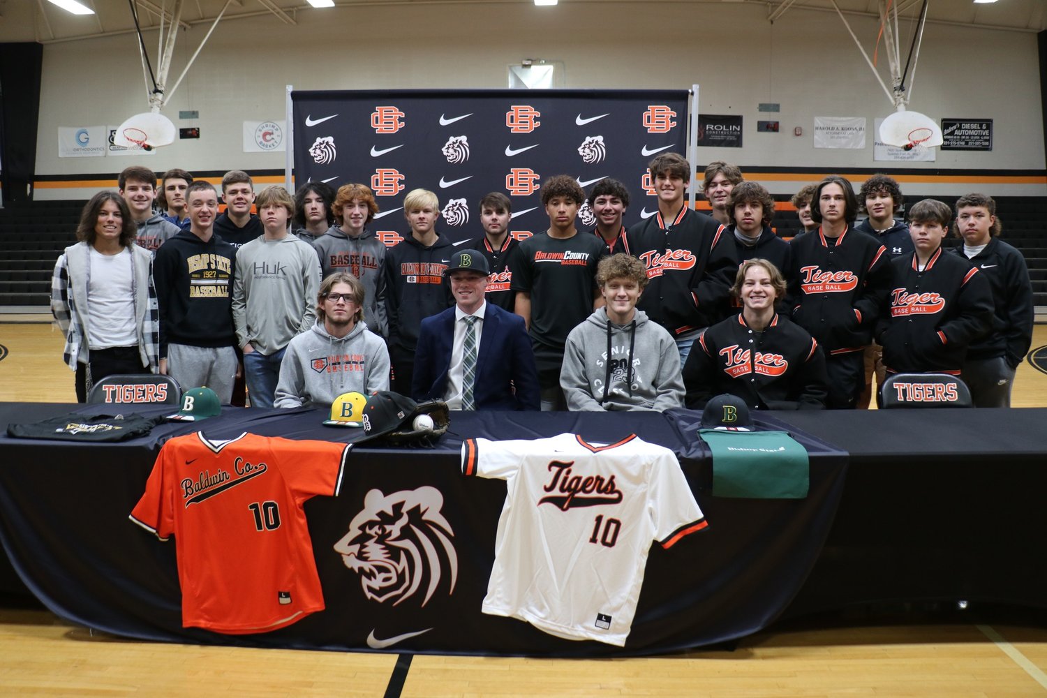 Teammates and classmates surround Trevor Murphy for a picture after the Nov. 17 signing ceremony at Baldwin County High School. Murphy inked the commitment he made to Bishop State baseball Oct. 13.