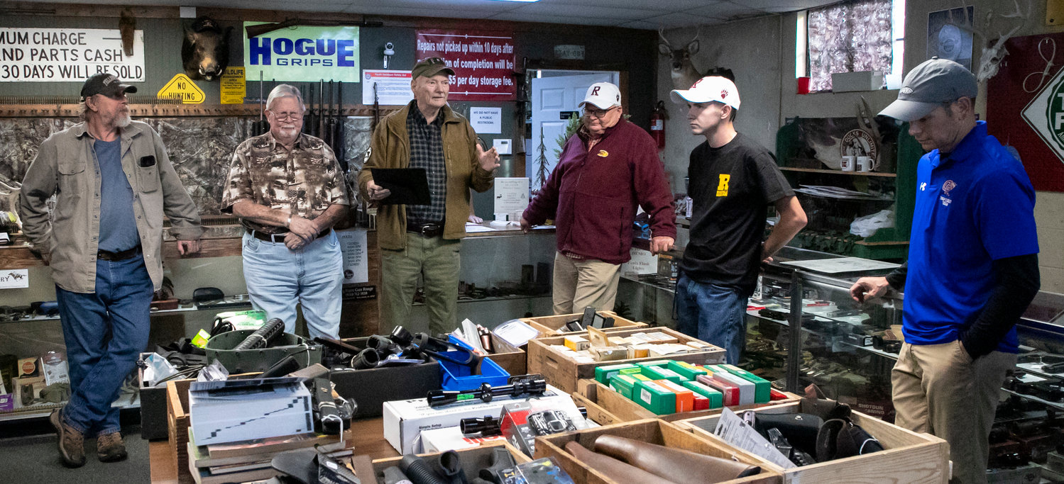 Gulf Coast Gun Collectors Association's Activities Chairman Medrick Northrop addresses the gathering at Greener Fields Firearm and GunSmithing in Foley Wednesday afternoon, Nov. 16, before presenting donation checks to sport shooting teams from Orange Beach and Robertsdale High School.