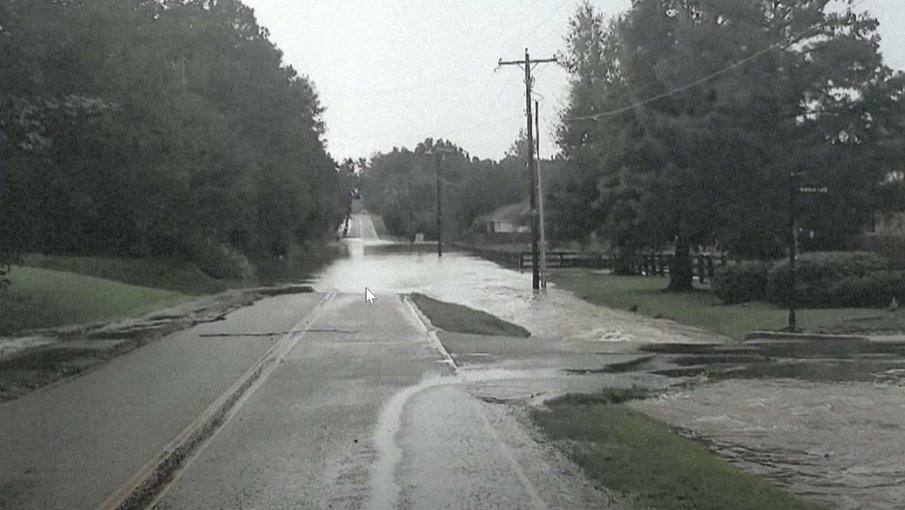 Floodwaters cover Booth Road in Fairfield Place subdivision after a heavy rain. Fairhope officials are studying drainage improvements to reduce flooding in the area.