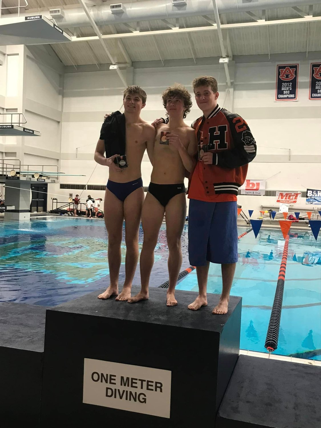 Fairhope’s Cooper Brechman, left, took second place in the 1-meter diving competition at the state championship meet in Auburn last weekend. He was one of 10 individuals and five relay teams that represented Baldwin County with podium finishes.