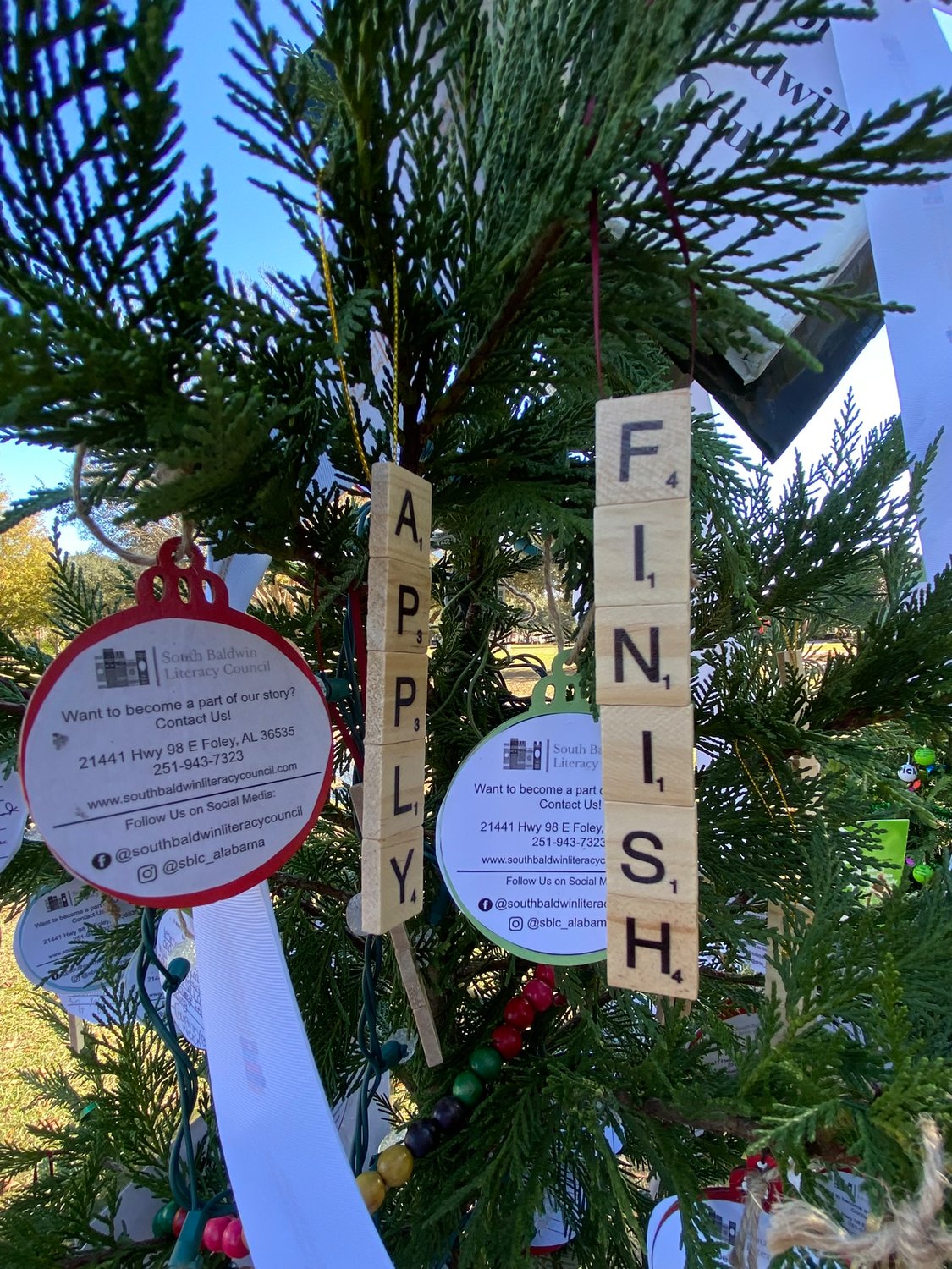 South Baldwin Literacy Council's tree holds ornaments from students with what they like learning about.