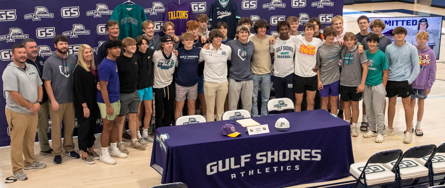 The gymnasium at Gulf Shores High School hosted a signing ceremony for Dolphin catcher Dominic Maldet and his pledge to the Montevallo Falcons Wednesday, Dec. 7. Family, friends, coaches, teammates and classmates celebrated Madlet’s accomplishment.