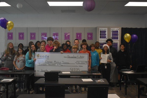 Students pose for a celebration photo after Daphne Middle School was awarded $16,000 in grants from SEEDS, Daphne's Education Foundation.