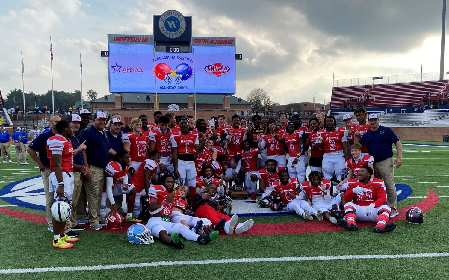 Team Alabama celebrates on the field of Hancock Whitney Stadium at the University of South Alabama Saturday afternoon, Dec. 10, after winning the 36th annual Alabama-Mississippi All-Star Classic 14-10. Foley’s Harrison Knight, third row far left, finished with 1 catch as Baldwin County’s lone representative.