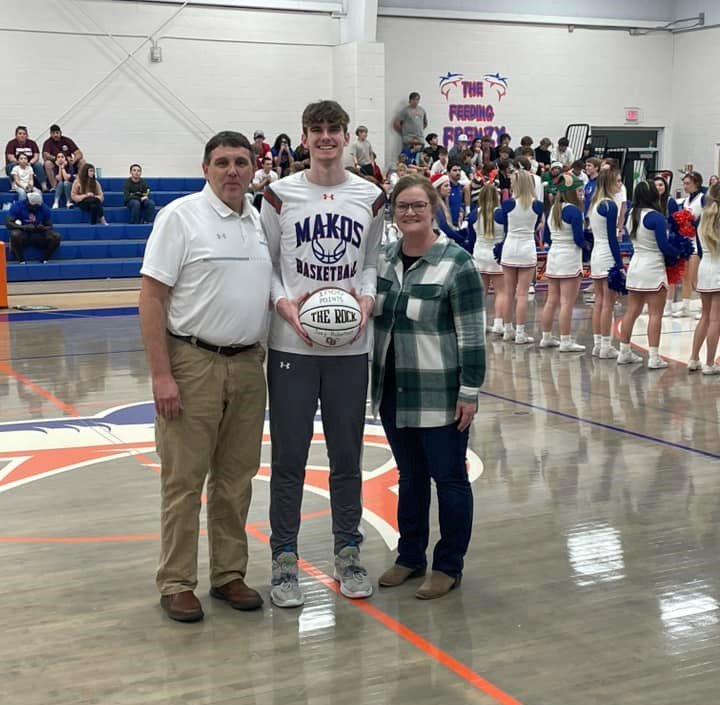 Orange Beach senior Joey Robertson was presented a replica basketball before the Makos’ game against Robertsdale at home Dec. 8, 2022, after he eclipsed 1,000 total points for his career the week prior. Robertson became the first Orange Beach player to be named all-state last year and he was once again a selection this season and landed on the third-team all-state.