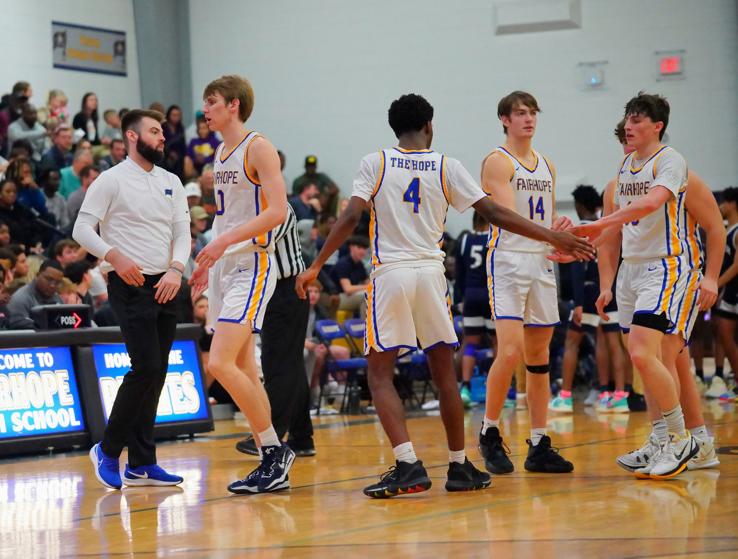 The Fairhope Pirates walk off the court during a timeout in their home non-area game against the Baker Hornets Dec. 13, 2022. Fairhope entered play Tuesday night as one of three local teams in first place in its respective area with only a week left in the regular season.