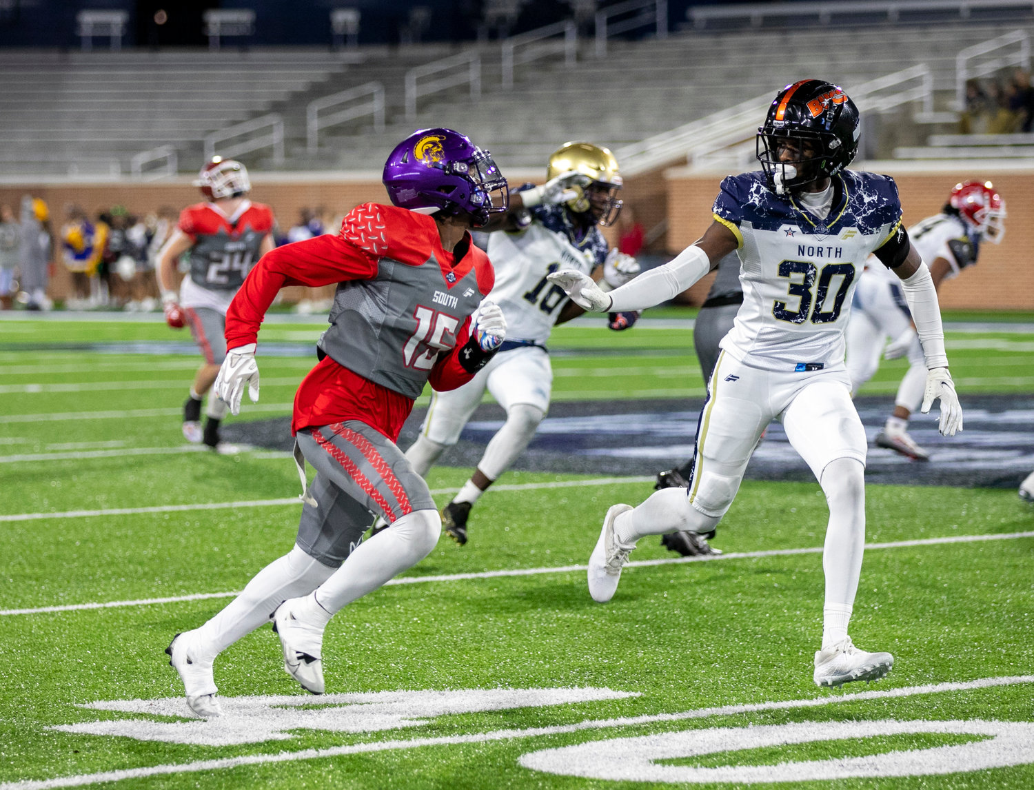 Daphne’s Stephon Blackshear searches for the ball on a first-half punt coverage Friday night at Hancock Whitney Stadium at the AHSAA North-South All-Star Football Classic. Blackshear caught one pass in the 42-7 win.