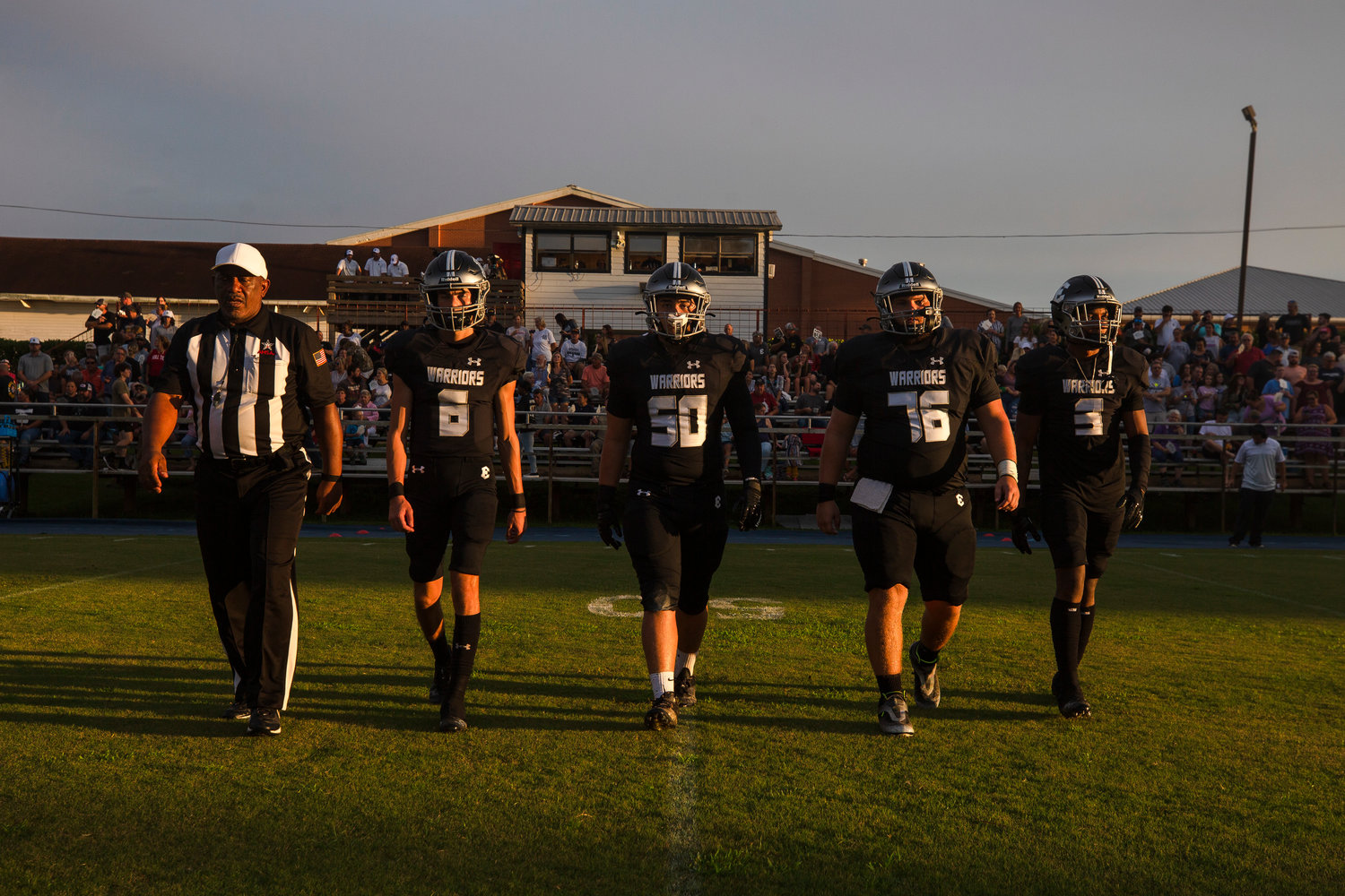 Elberta’s Cason White (76) was joined by classmates Hunter Powers (6), Jared Fralick (50) and Tyshaun Washington (3) in walking out for the coin toss ahead of the Warriors’ season-opening contest against the Bayside Academy Admirals Aug. 19. White was named an all-state honorable mention and became the second Elberta player recognized by the Alabama Sports Writers Association.