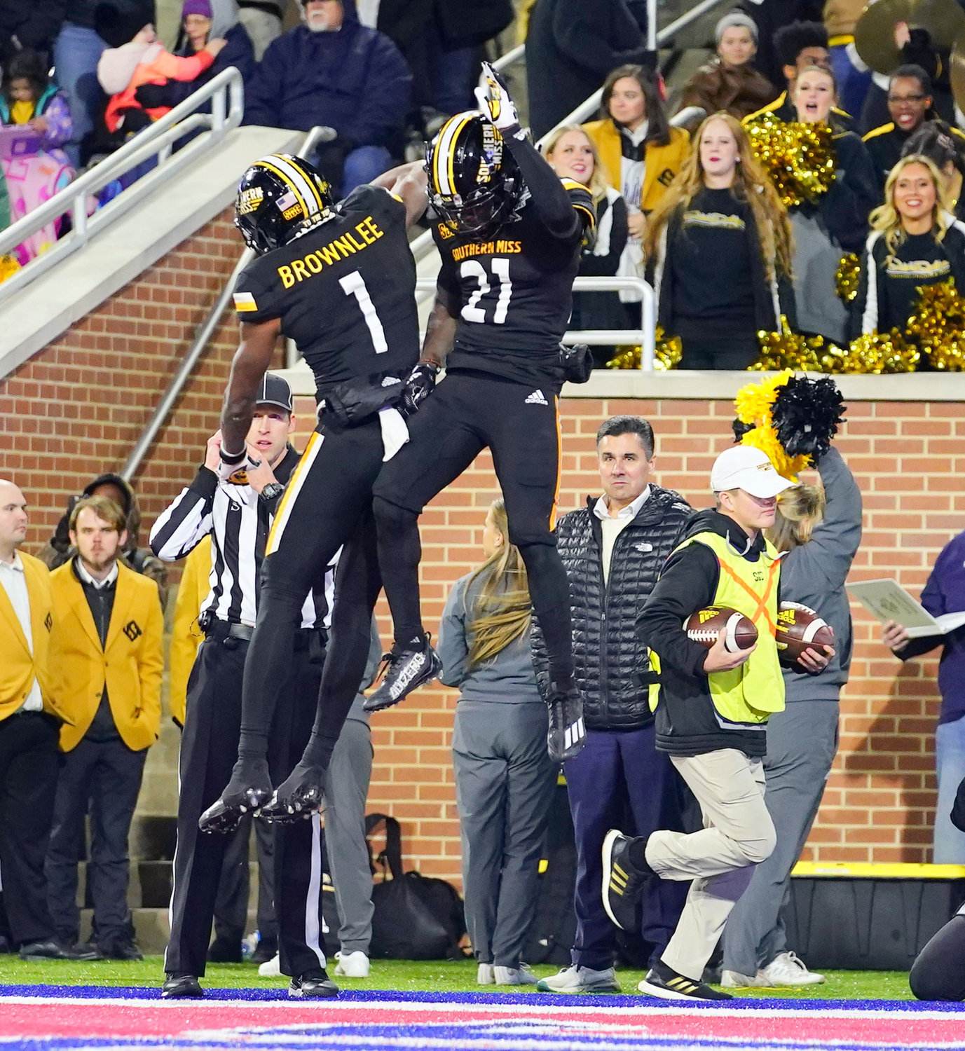 Golden Eagle freshman Tiaquelin Mims (21) celebrates his receiving touchdown with senior Jason Brownlee (1) in the third quarter of the Lending Tree Bowl against the Rice Owls at Hancock Whitney Stadium Saturday, Dec. 17, in Mobile. Mims’ score helped Southern Miss earn a 38-24 victory to finish 7-6 overall on the season.