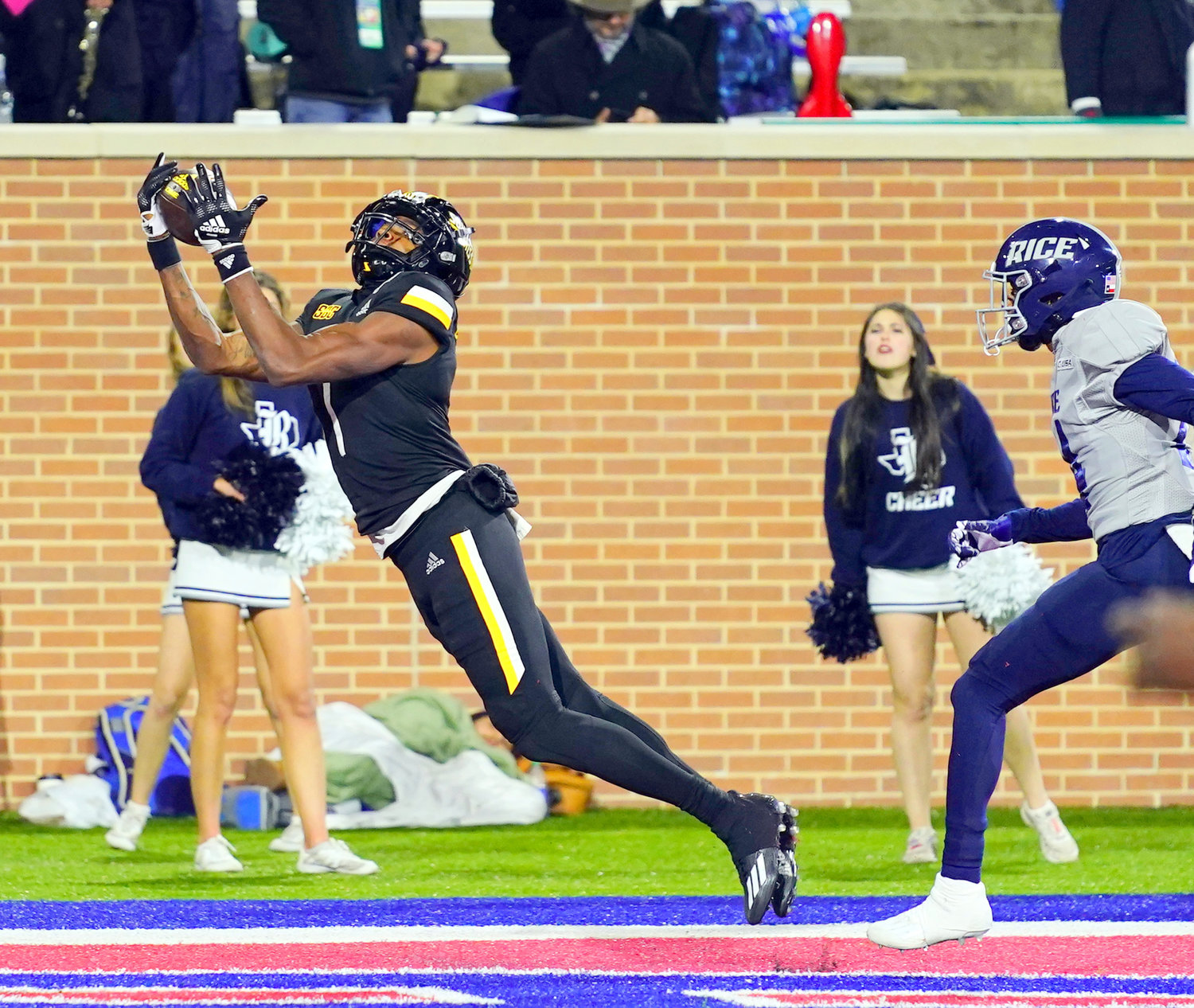 Southern Miss senior Jason Brownlee extends for a fourth-quarter touchdown reception that helped the Golden Eagles take down Rice 38-24 in the Lending Tree Bowl Saturday night at Mobile’s Hancock Whitney Stadium.