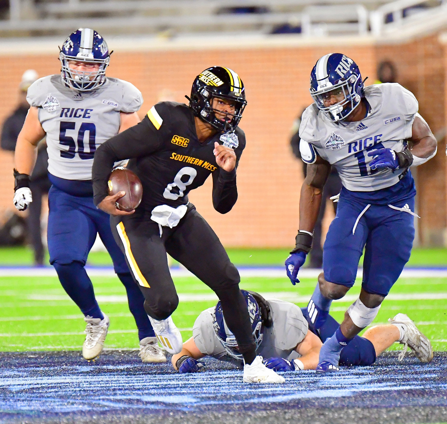 Golden Eagle quarterback Trey Lowe III makes a move while scrambling out of the pocket in the second half of the Lending Tree Bowl between Southern Miss and Rice at Hancock Whitney Stadium in Mobile Saturday night, Dec. 17.