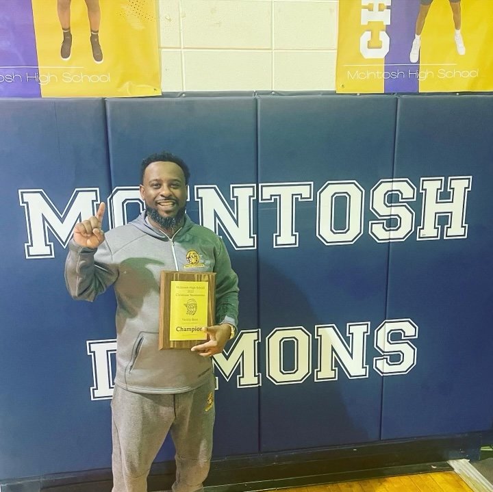 Robertsdale head basketball coach Marshall Davis celebrates winning the tournament at his alma mater, McIntosh, Thursday, Dec. 22, to help the Golden Bears improve to 15-3 overall on the season.