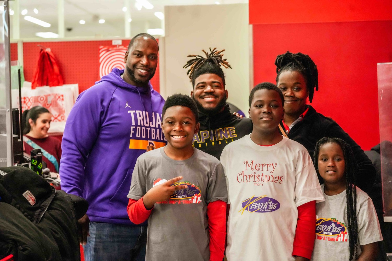 Kenny King Charities hosted its ninth annual Shop-A-Thon at Target Friday, Dec. 23, where children were partnered with their favorite Daphne Trojans football players to fulfill Christmas wishes.