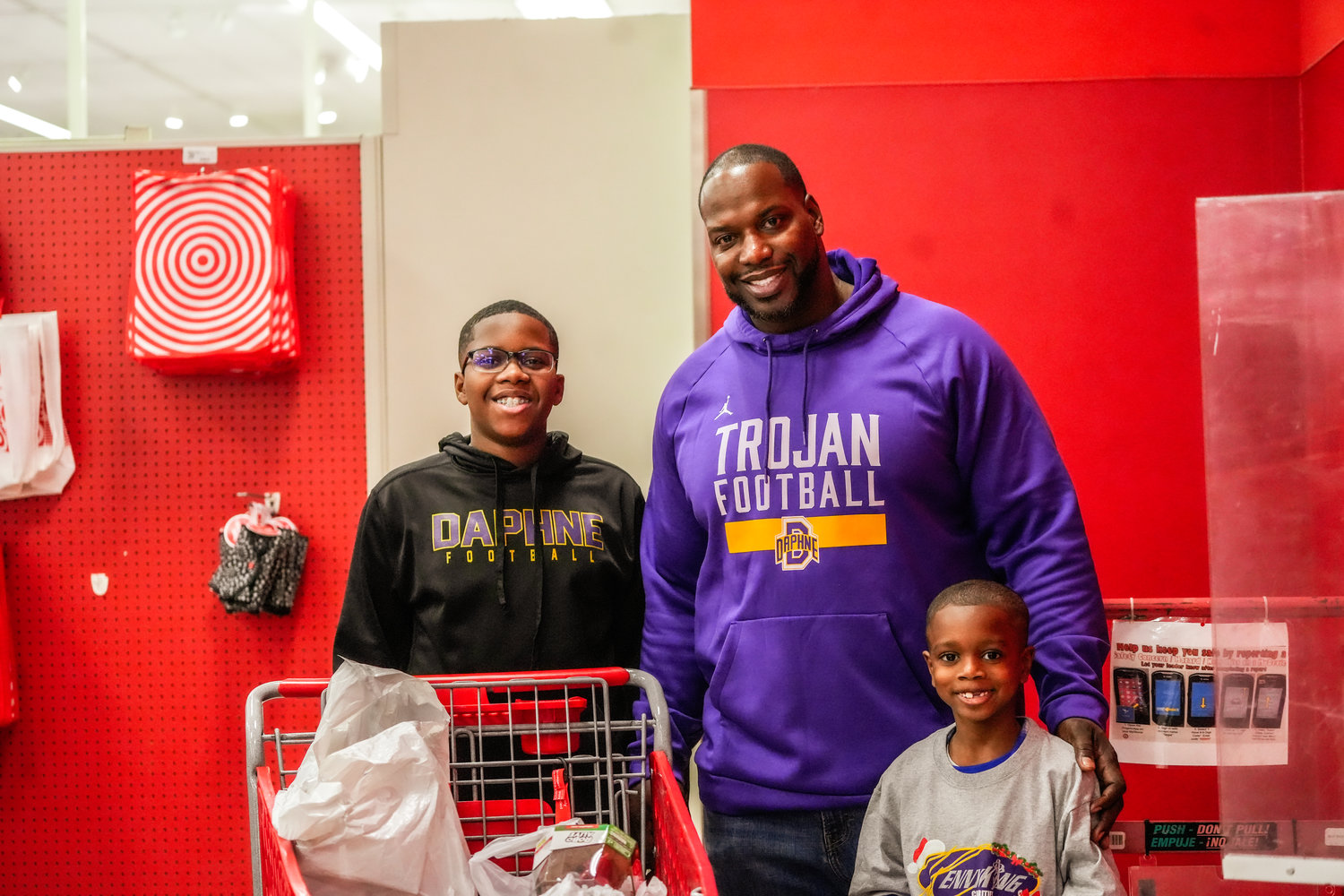 Kenny King, founder of Kenny King Charities and head football coach at Daphne High School, hosted the ninth annual Christmas Shop-A-Thon at Target last Friday, Dec. 23, where 25 local children got their holiday wishes fulfilled.